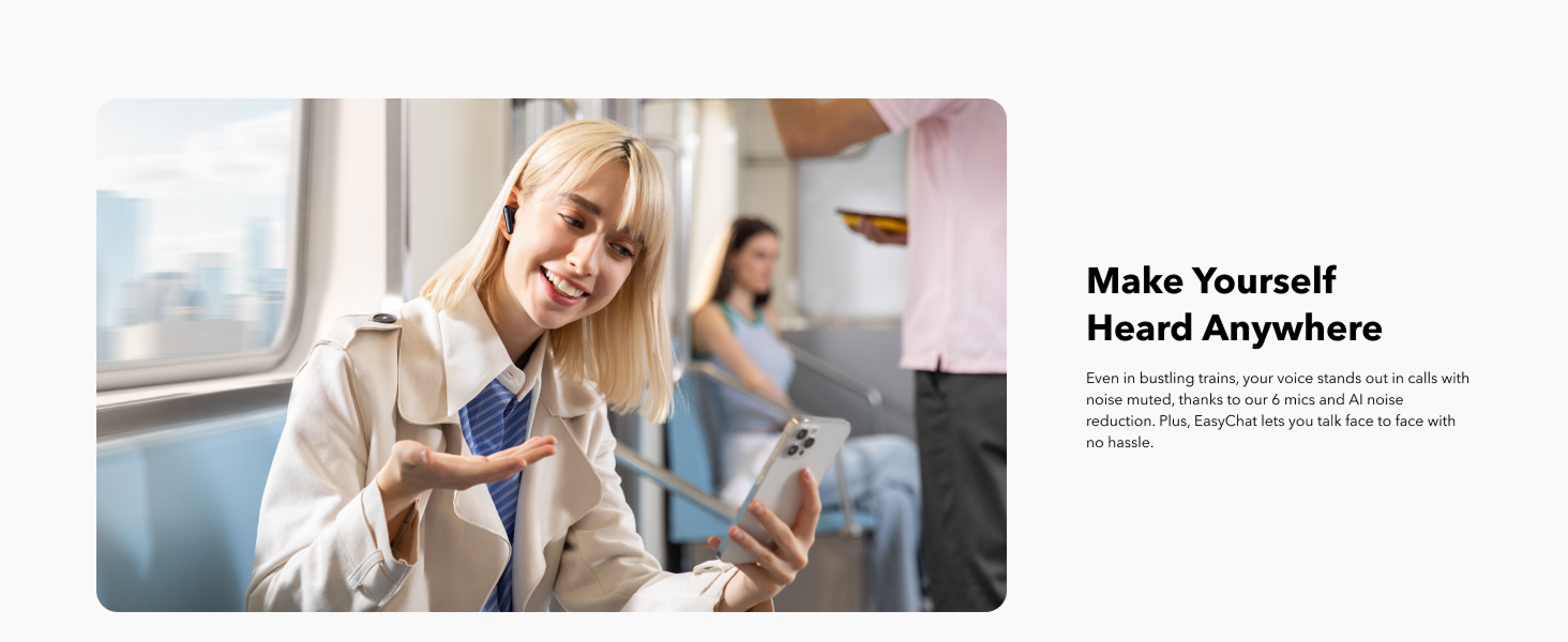 A woman with blonde hair using her phones and wearing black earphones in a train.